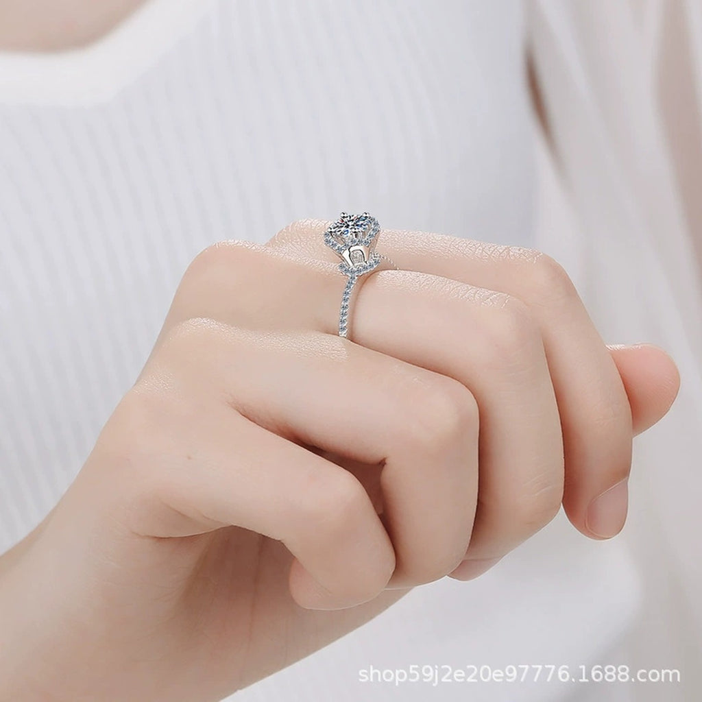 Round Moissanite Side Stone Ring with CZ worn on hand to show scale, band width, and ring profile