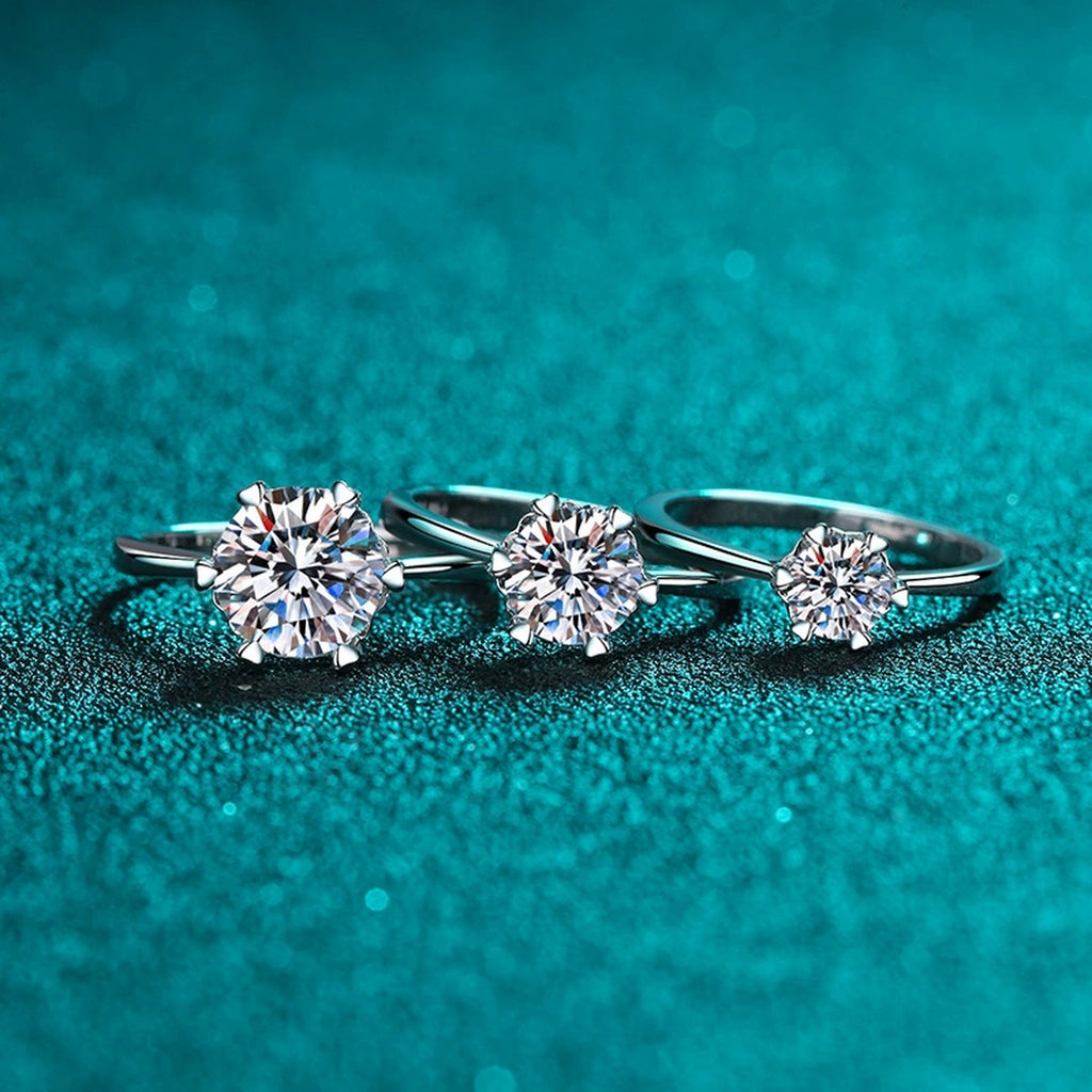 Round Moissanite Adjustable Three Stone Ring worn on hand to show scale, band width, and ring profile