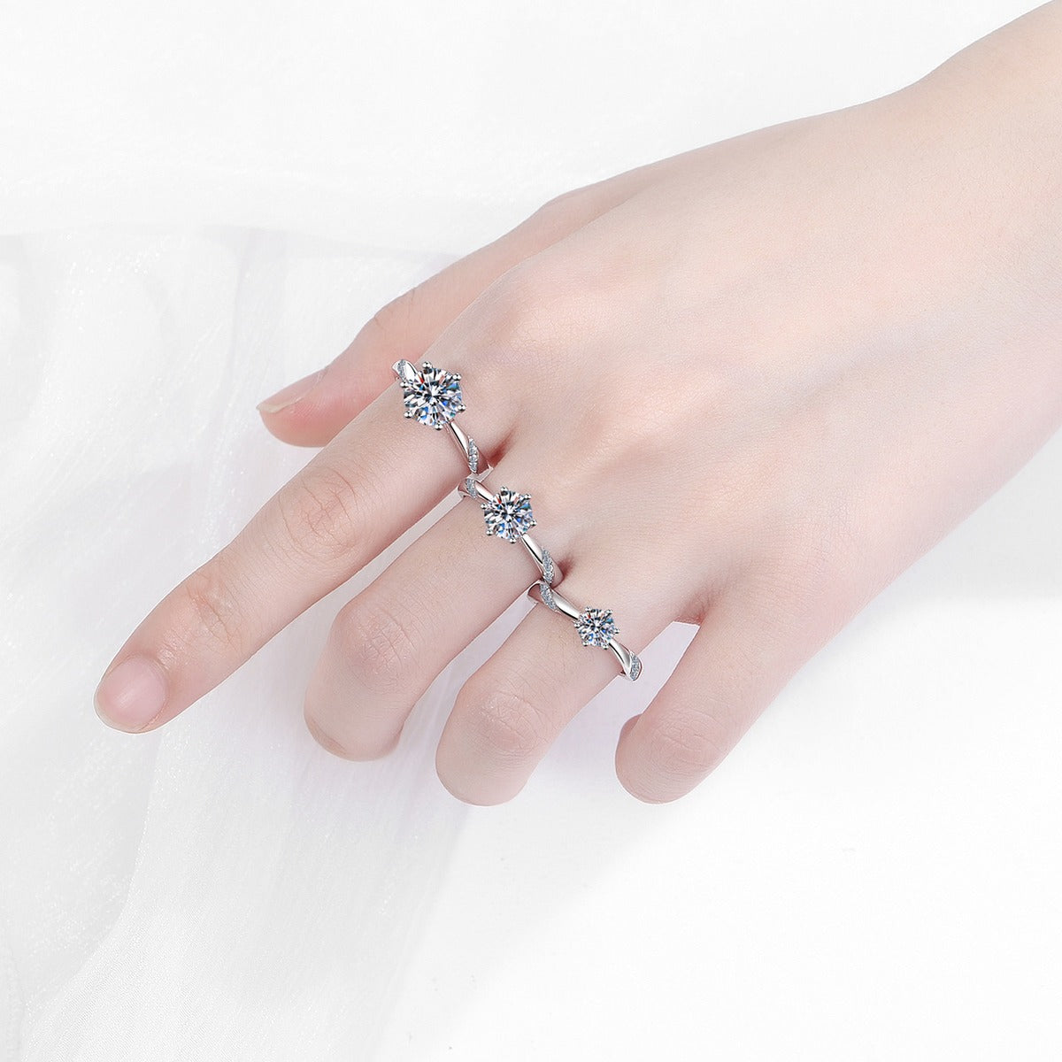 Round Moissanite Solitaire Ring in rhodium-plated S925 sterling silver on clean white background