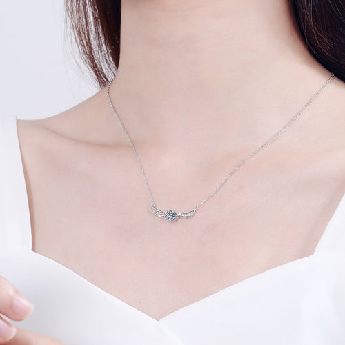 Angel Wing Moissanite Pendant Necklace in Rhodium-Plated S925 sterling silver worn on neckline by model showing scale and adjustable chain styling