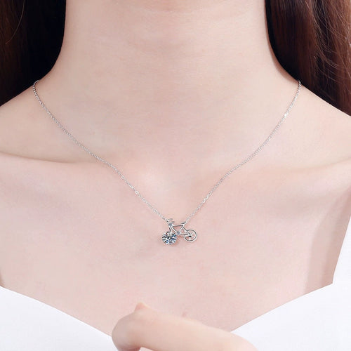 Bicycle Moissanite Pendant Necklace with CZ in Rhodium-Plated S925 sterling silver worn on neckline by model showing scale and adjustable chain styling