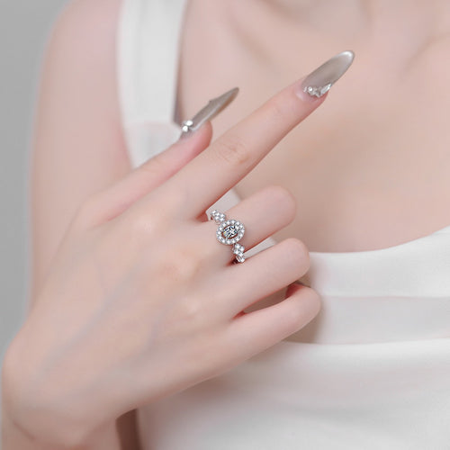 Blue and White Oval Moissanite Ring with CZ in Rhodium-Plated S925 Sterling Silver worn on hand, showing scale, finger coverage, and rhodium-plated finish