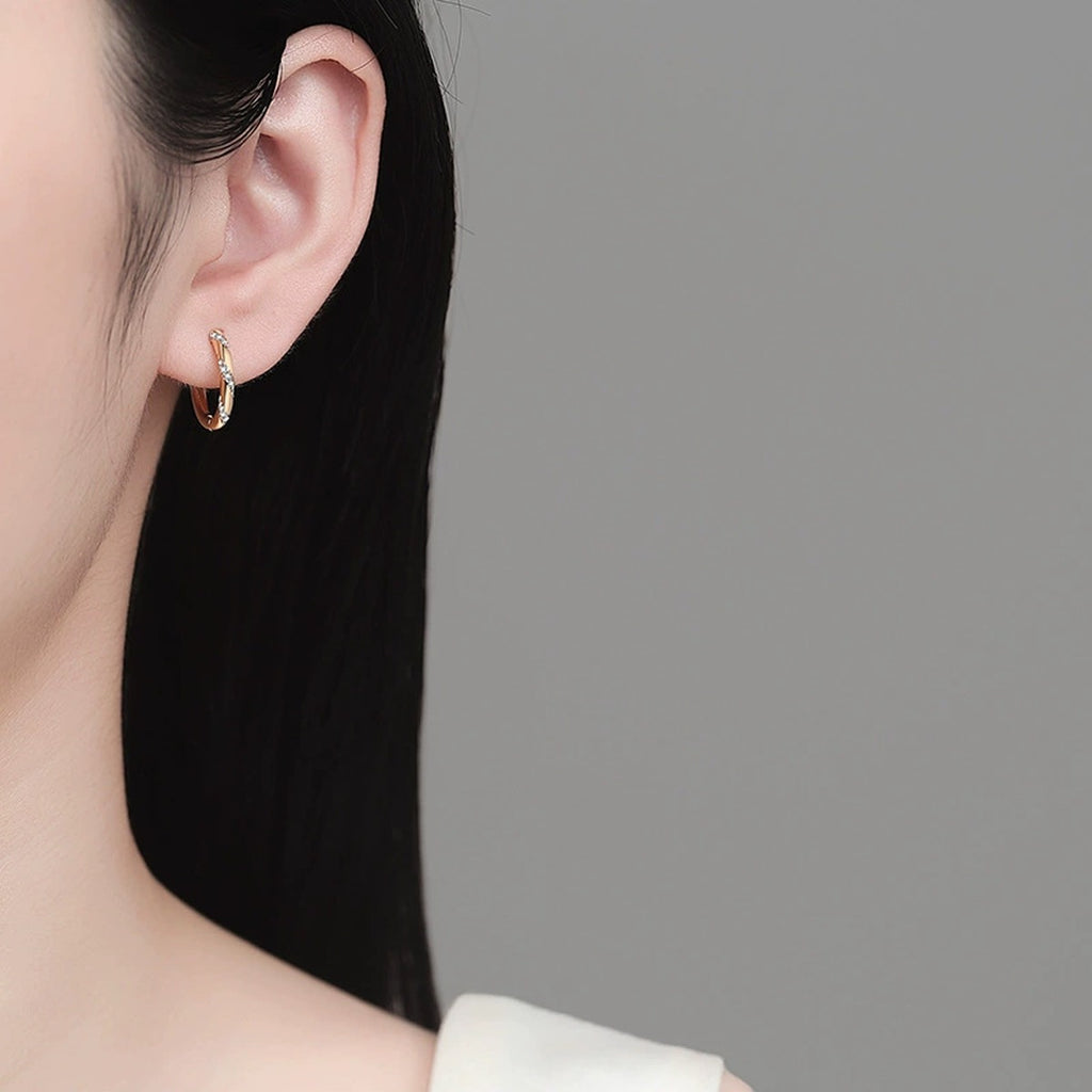 Pave Moissanite Hoop Earrings in Champion Gold-Plated S925 sterling silver worn on ear by model showing scale, placement, and hoop earrings styling