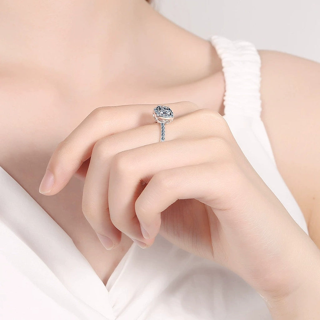 Cushion Halo Moissanite Ring with CZ worn on hand to show scale and ring profile