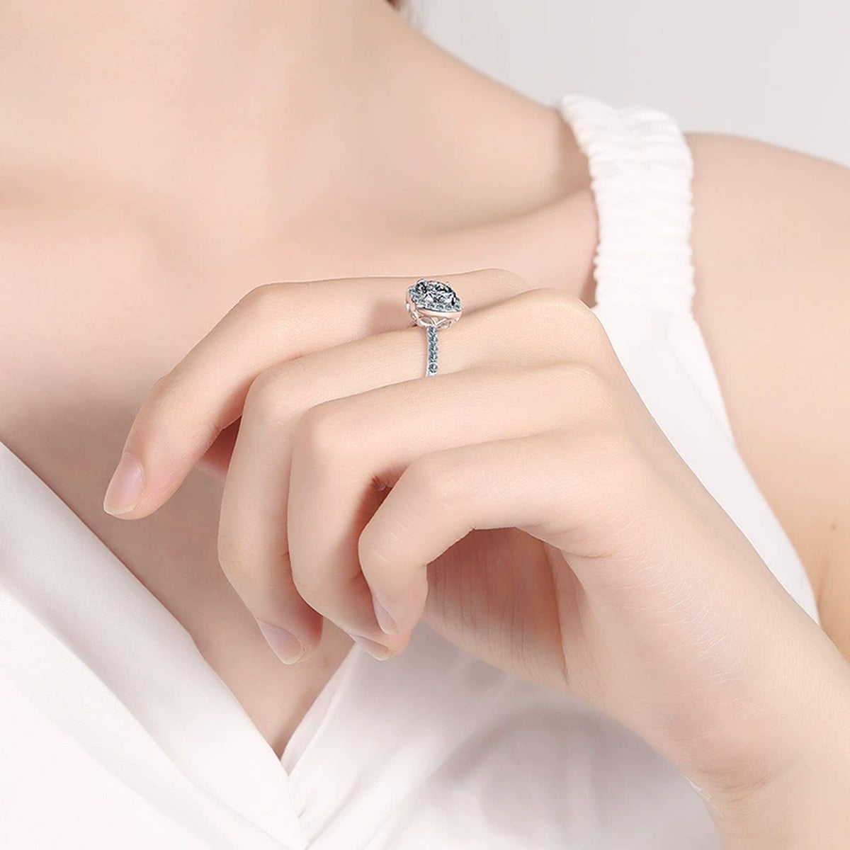 Cushion Halo Moissanite Ring with CZ worn on hand to show scale and ring profile