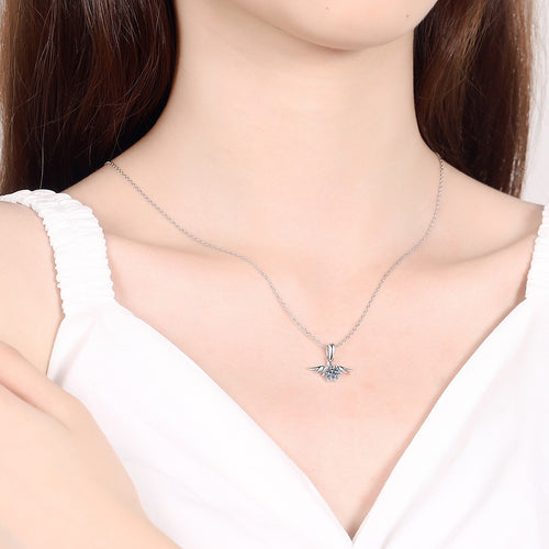 Angel Wing Moissanite Pendant Necklace in Rhodium-Plated S925 sterling silver worn on neckline by model showing scale and adjustable chain styling