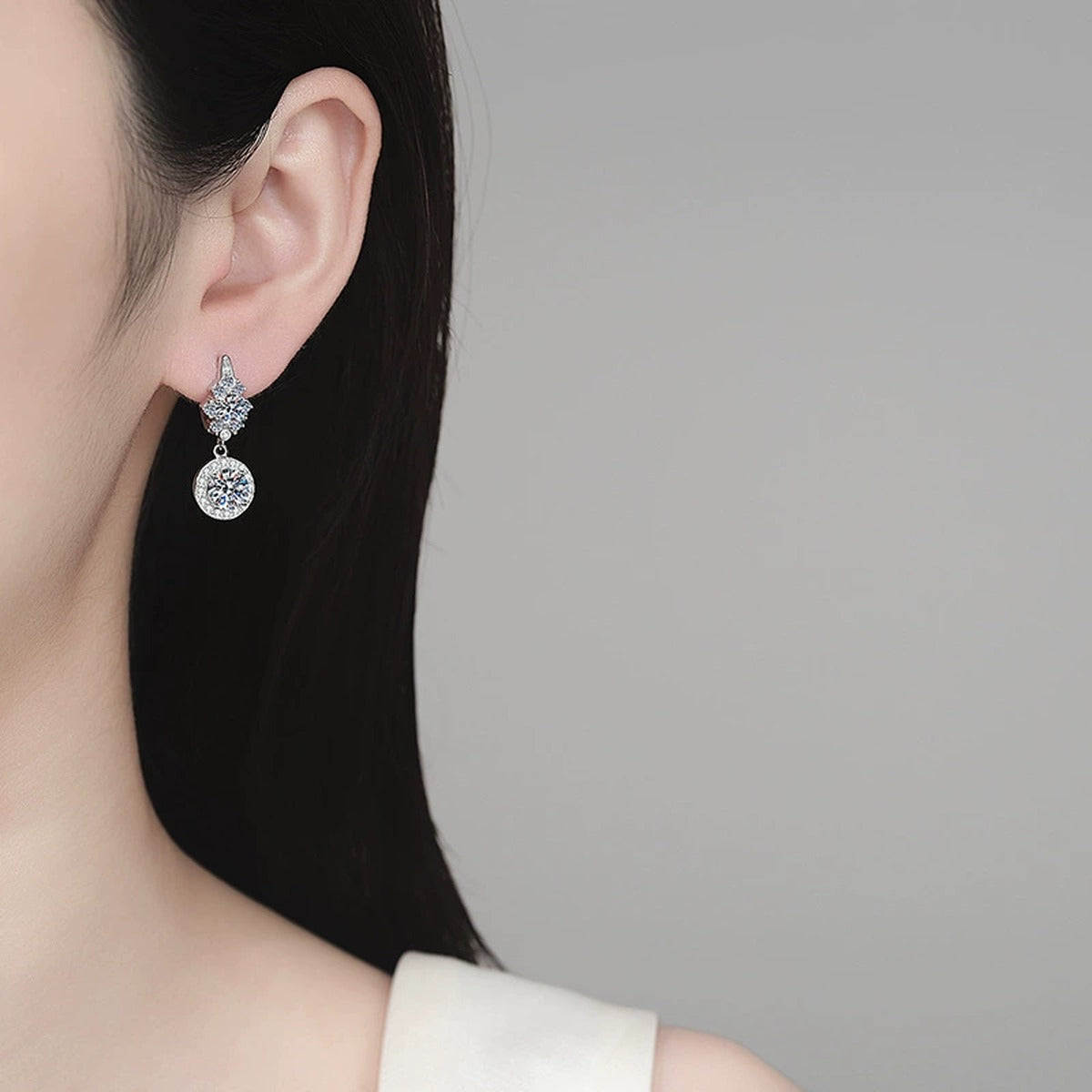 Round Moissanite Hoop Dangle Earrings with CZ in Rhodium-Plated S925 sterling silver worn on ear by model showing scale, placement, and hoop dangle earrings styling