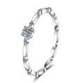 Twist Moissanite Band Ring with CZ in rhodium-plated S925 sterling silver on clean white background