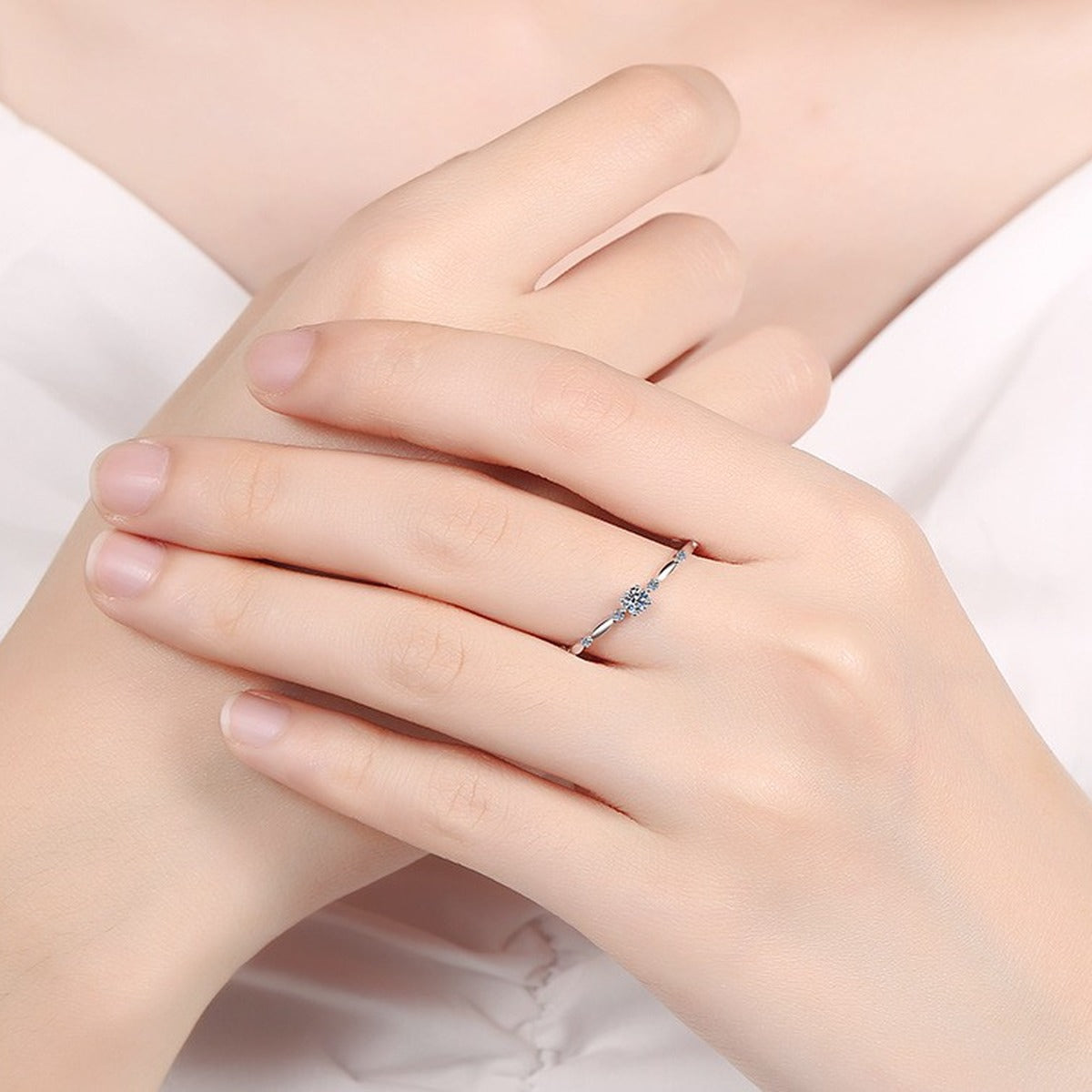 Twist Moissanite Band Ring with CZ worn on hand to show scale and ring profile