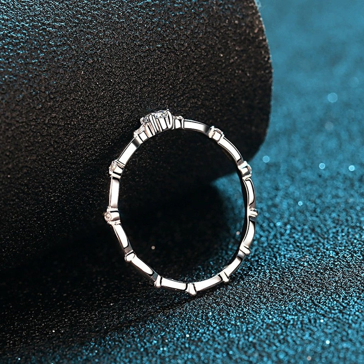 Twist Moissanite Band Ring with CZ product view showing moissanite setting and rhodium finish