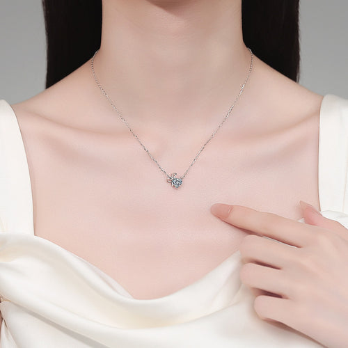 Bow Heart Moissanite Pendant Necklace in Rhodium-Plated S925 sterling silver neckline model view showing pendant scale and adjustable chain