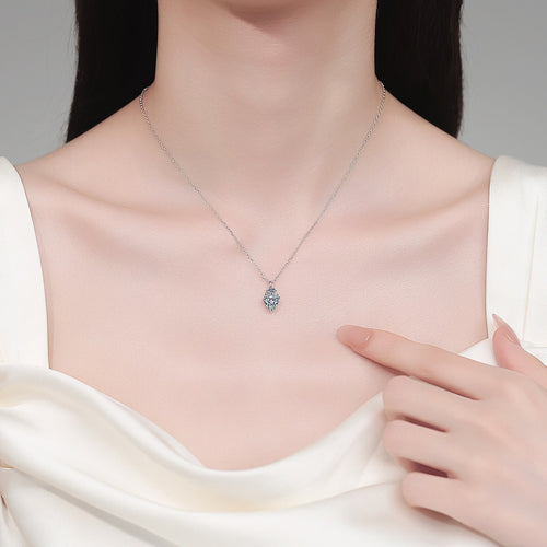 Bow Heart and Round Moissanite Pendant Necklace in Rhodium-Plated S925 sterling silver neckline model view showing pendant scale and adjustable chain