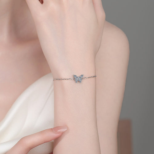 Butterfly Moissanite Chain Bracelet in Rhodium-Plated S925 sterling silver worn on wrist model view showing scale and adjustable fit
