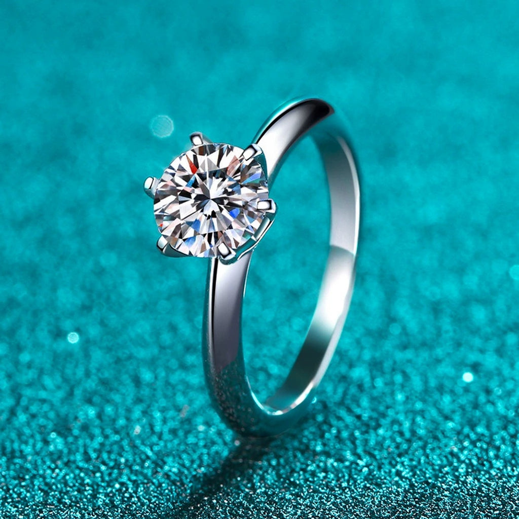 Round Moissanite Solitaire Ring product view showing moissanite setting and rhodium finish