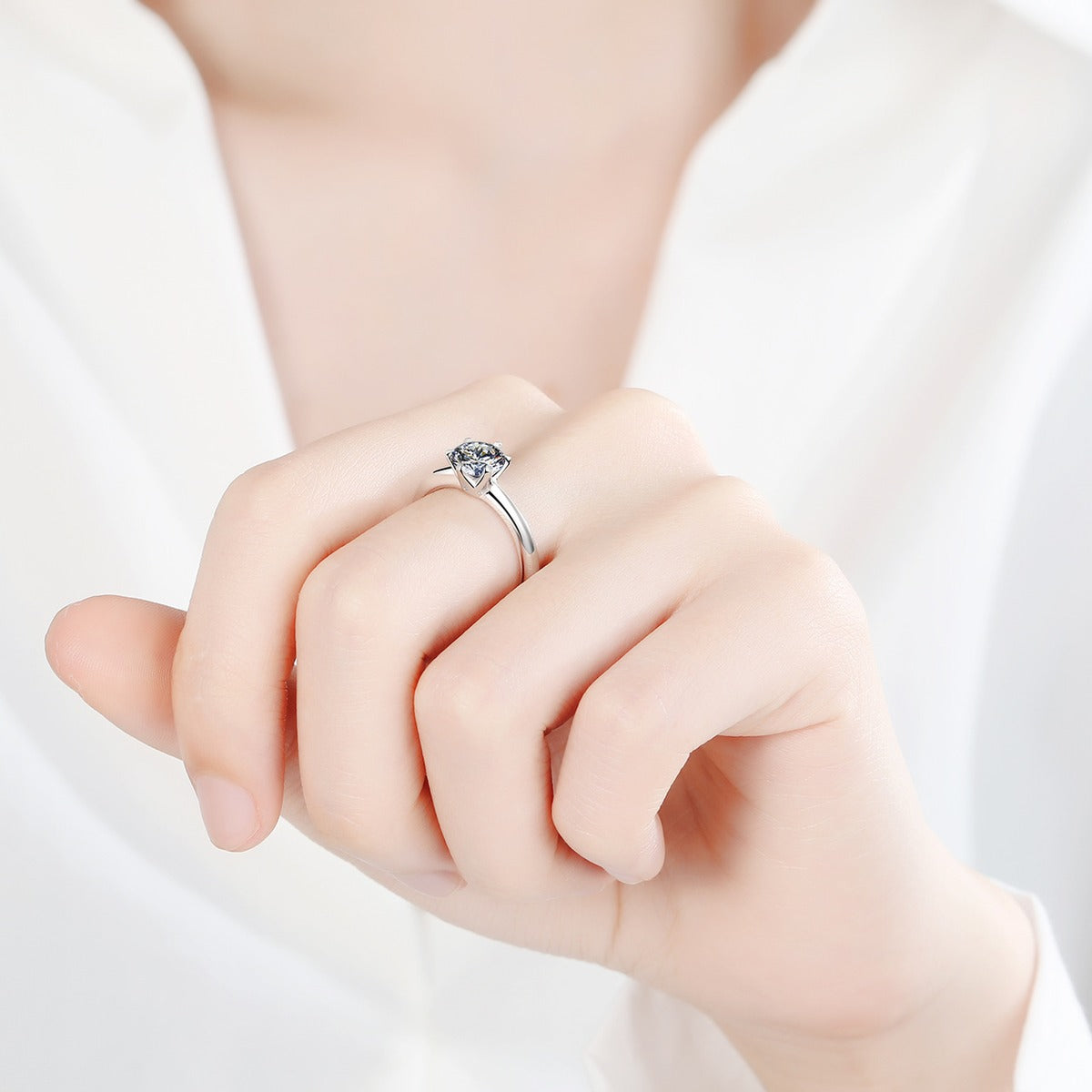 Round Moissanite Solitaire Ring worn on hand to show scale and ring profile