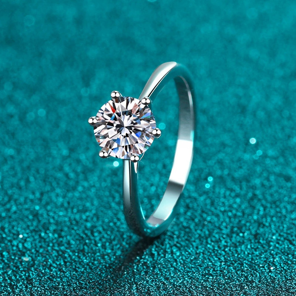 Round Moissanite Solitaire Ring product view showing moissanite setting and rhodium finish