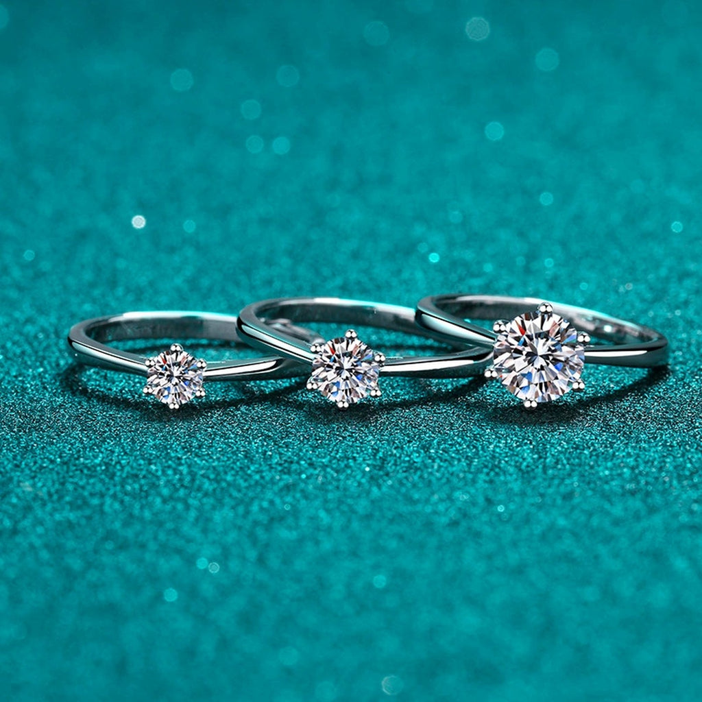 Round Moissanite Solitaire Ring product view showing moissanite setting and rhodium finish