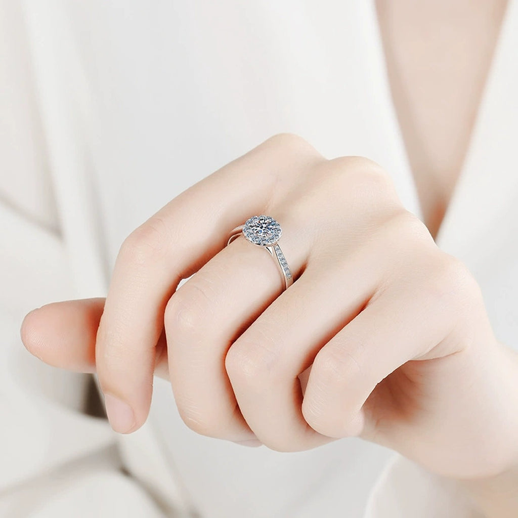Round Halo Moissanite Ring with CZ worn on hand to show scale and ring profile