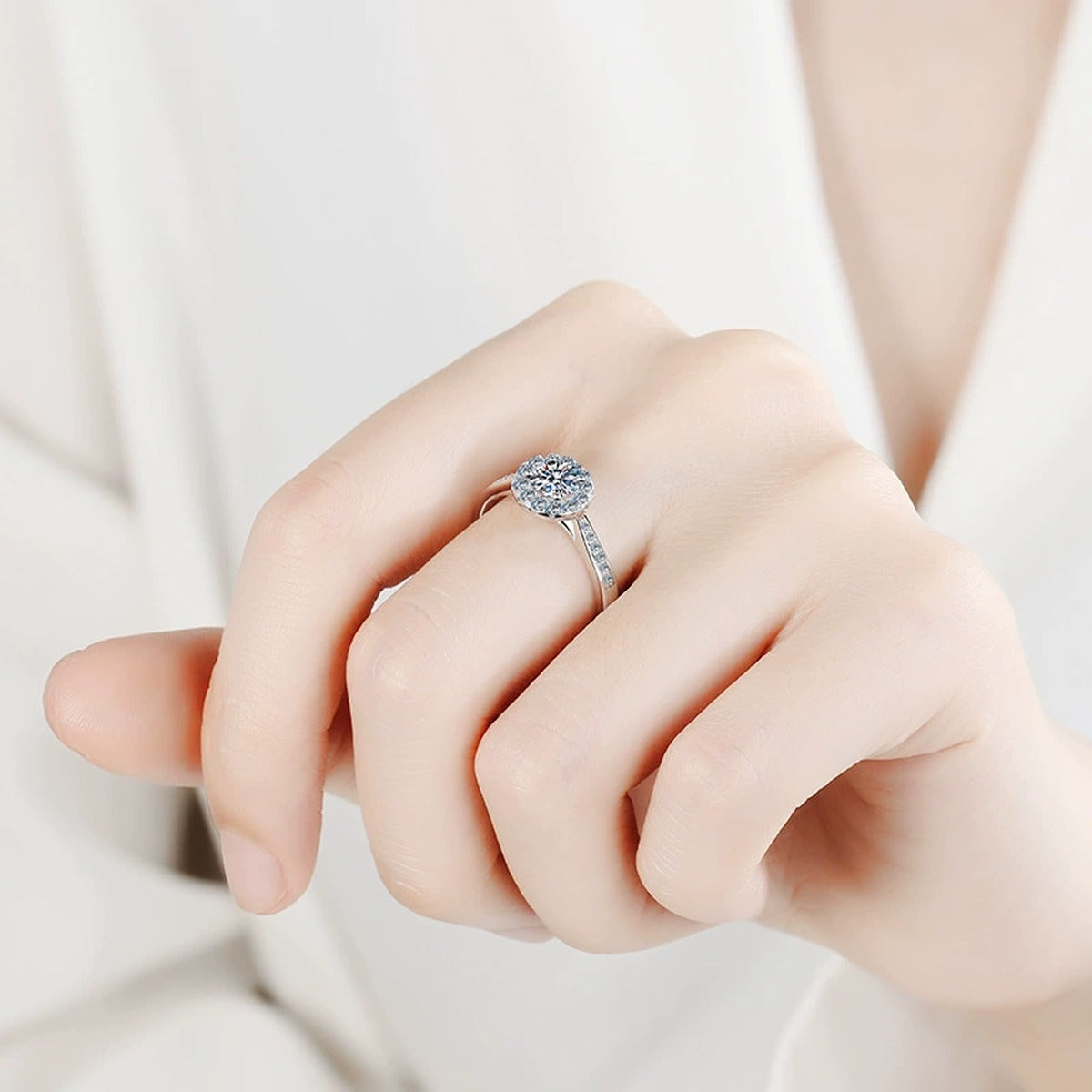 Round Halo Moissanite Ring with CZ worn on hand to show scale and ring profile