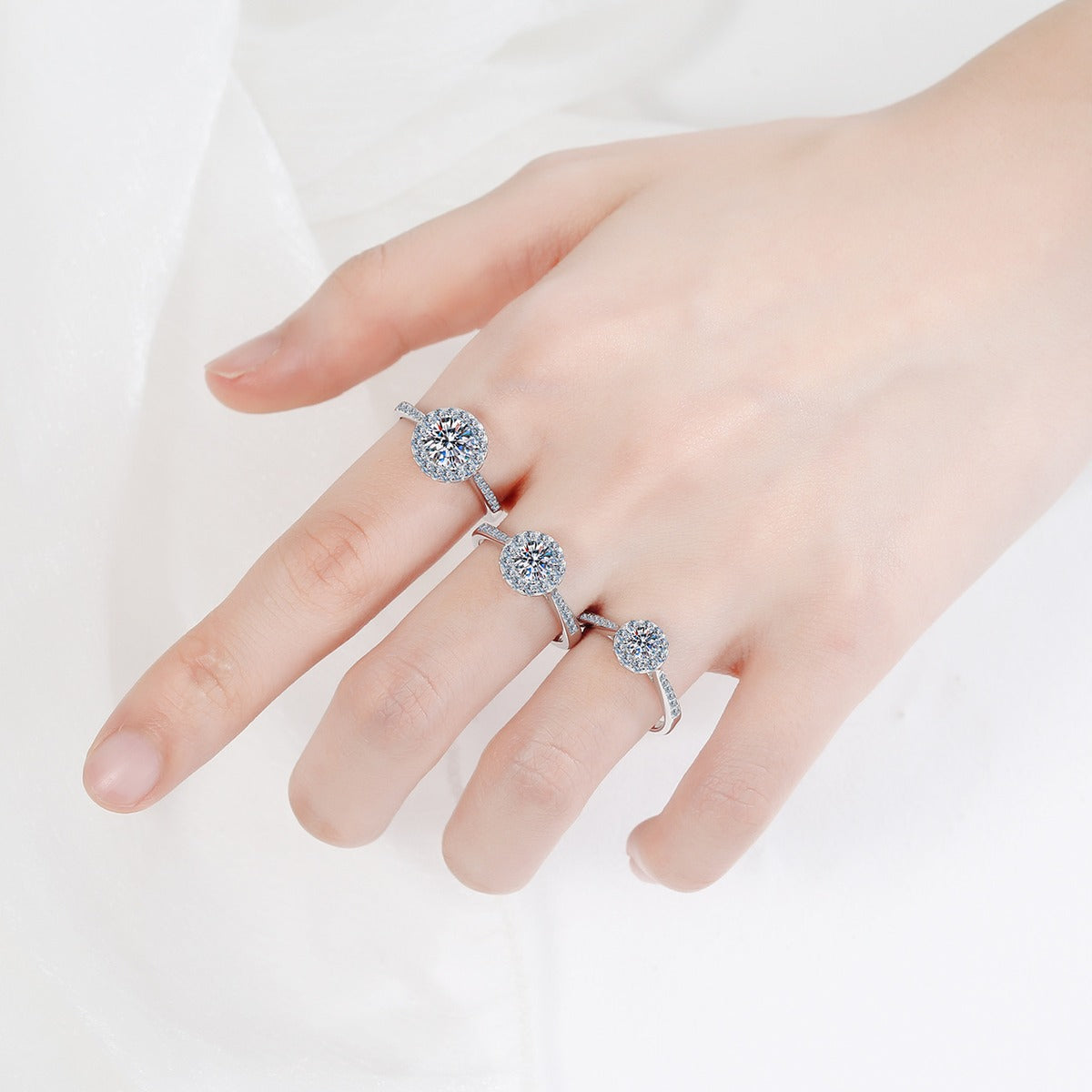 Round Halo Moissanite Ring with CZ worn on hand to show scale and ring profile