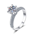 Round Moissanite Side Stone Ring with CZ in rhodium-plated S925 sterling silver on clean white background