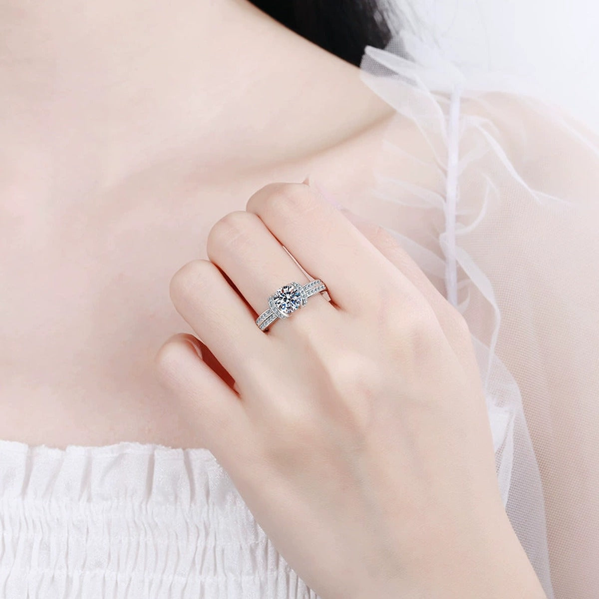 Round Halo Moissanite Ring with CZ worn on hand to show scale and ring profile