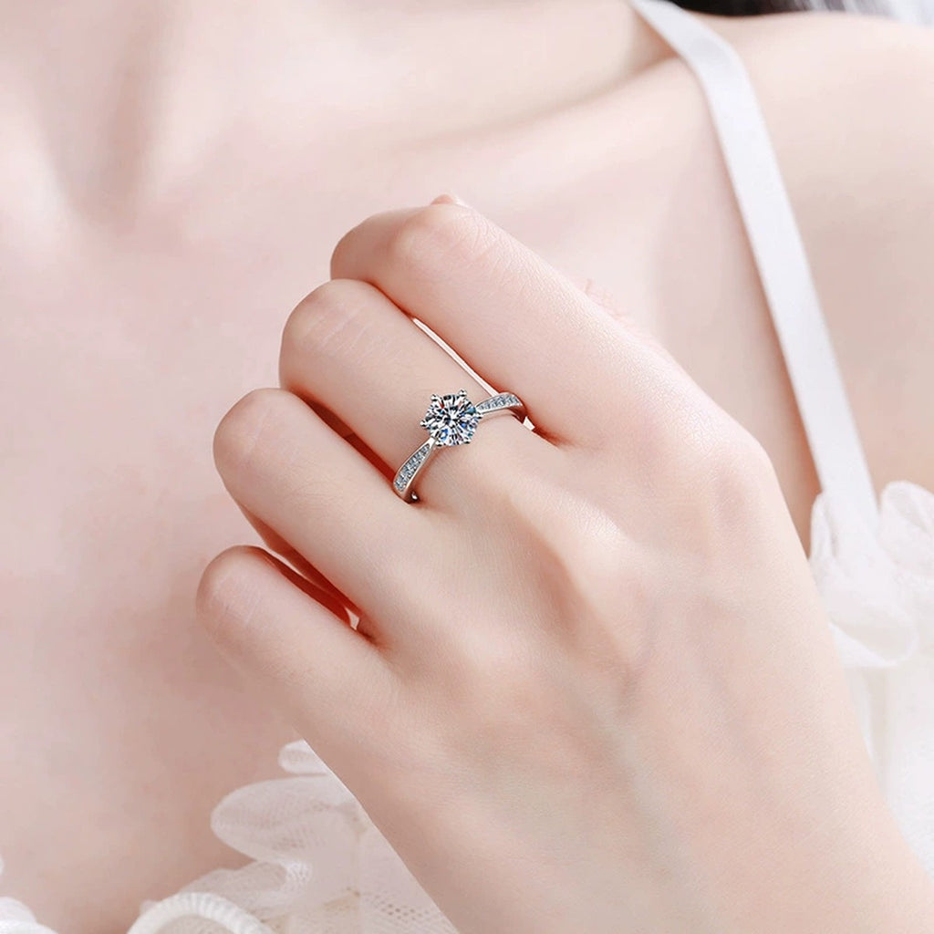 Round Moissanite Side Stone Ring with CZ worn on hand to show scale and ring profile