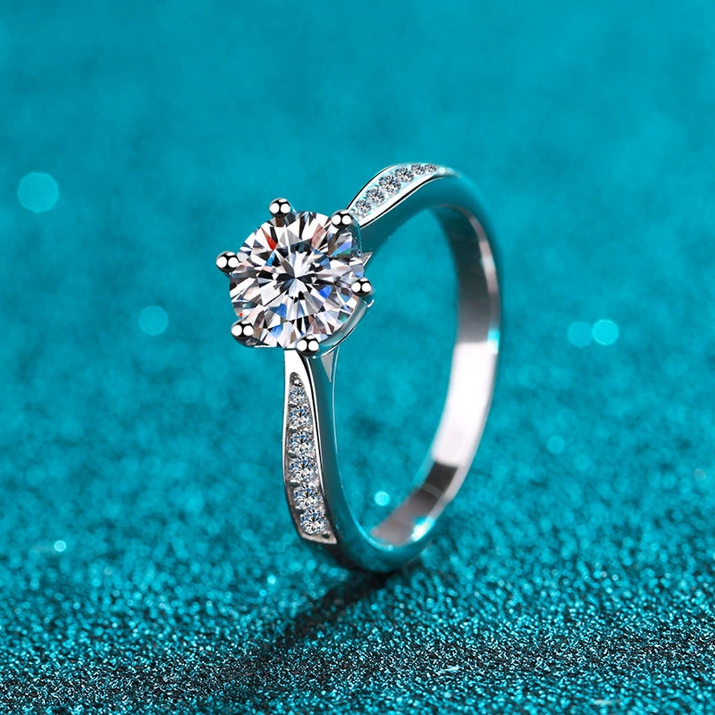 Round Moissanite Side Stone Ring with CZ product view showing moissanite setting and rhodium finish