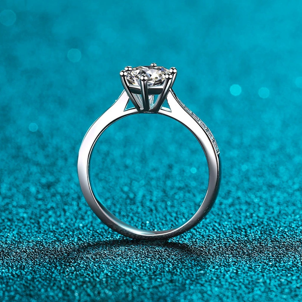 Round Moissanite Side Stone Ring with CZ product view showing moissanite setting and rhodium finish