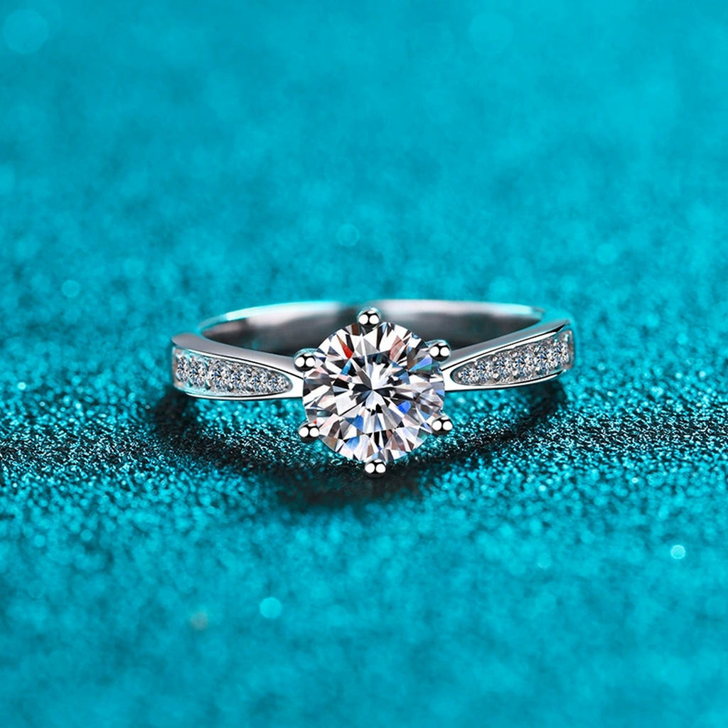 Round Moissanite Side Stone Ring with CZ product view showing moissanite setting and rhodium finish