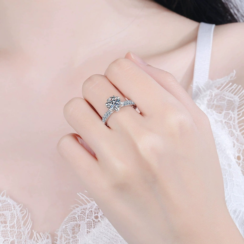 Round Moissanite Side Stone Ring with CZ worn on hand to show scale and ring profile
