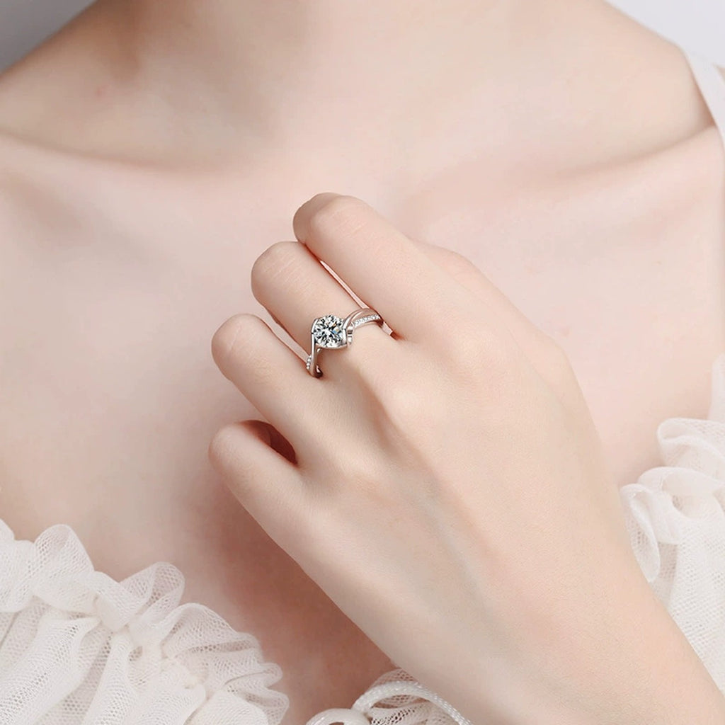 Round Moissanite Side Stone Ring with CZ worn on hand to show scale and ring profile