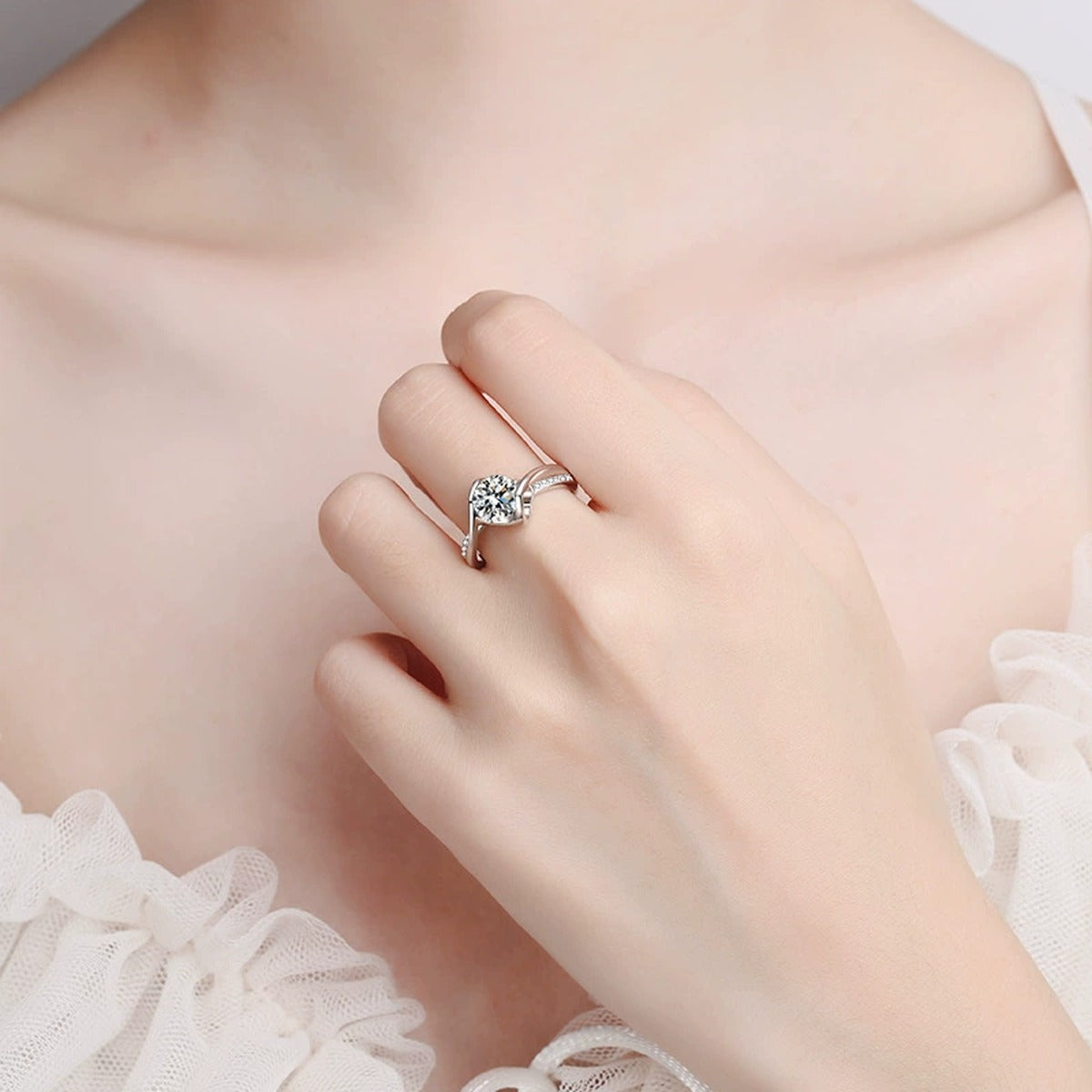 Round Moissanite Side Stone Ring with CZ worn on hand to show scale and ring profile