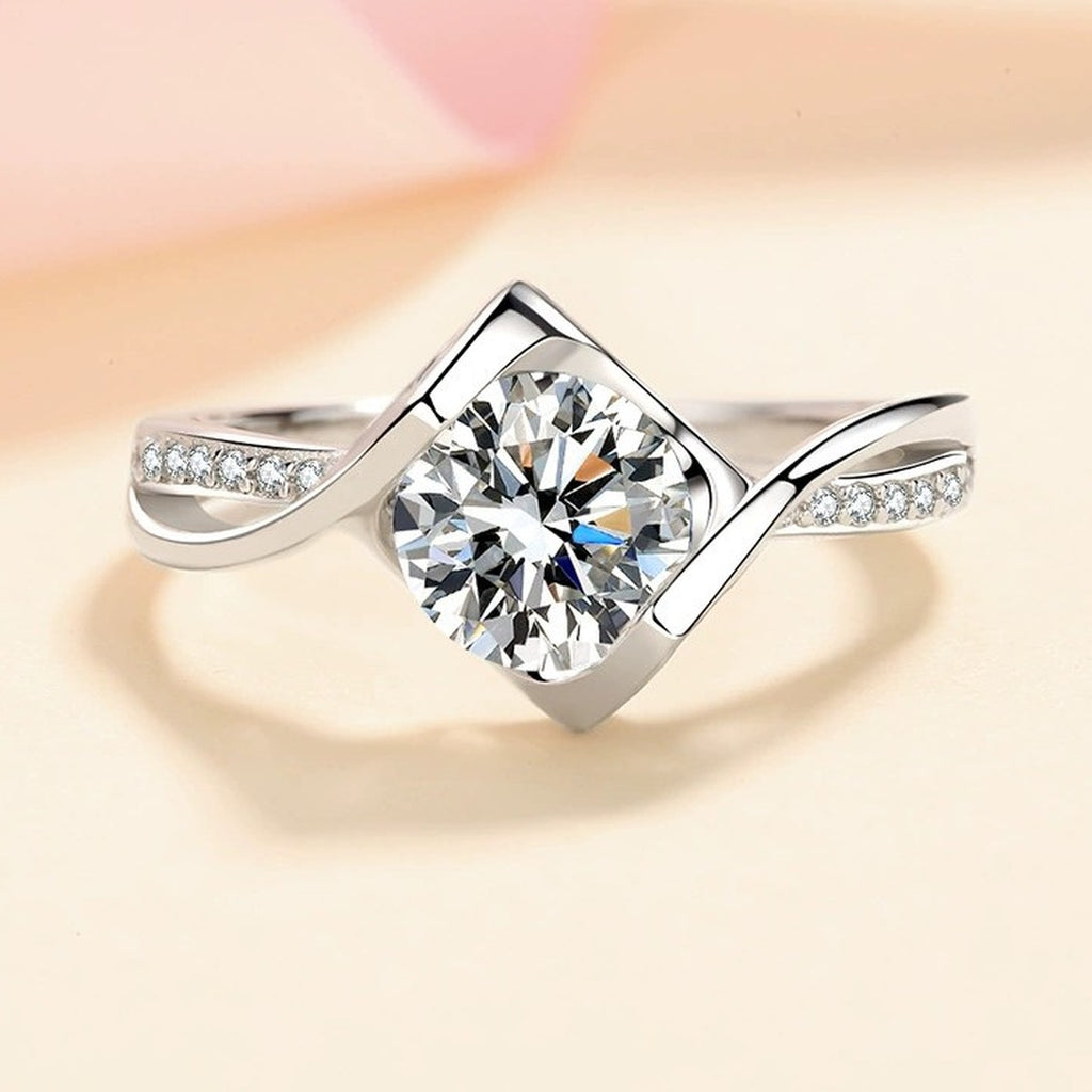 Round Moissanite Side Stone Ring with CZ worn on hand to show scale and ring profile