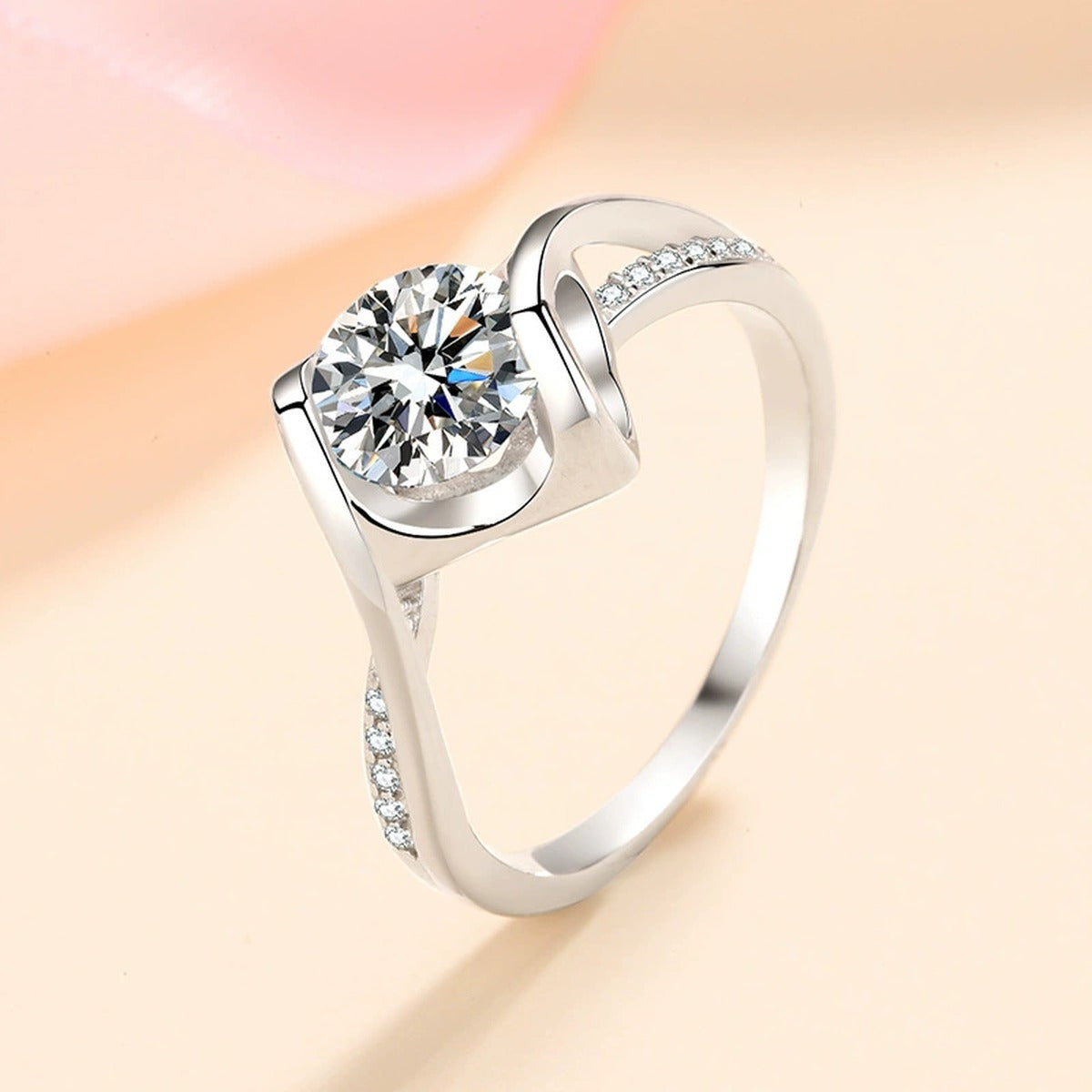 Round Moissanite Side Stone Ring with CZ worn on hand to show scale and ring profile