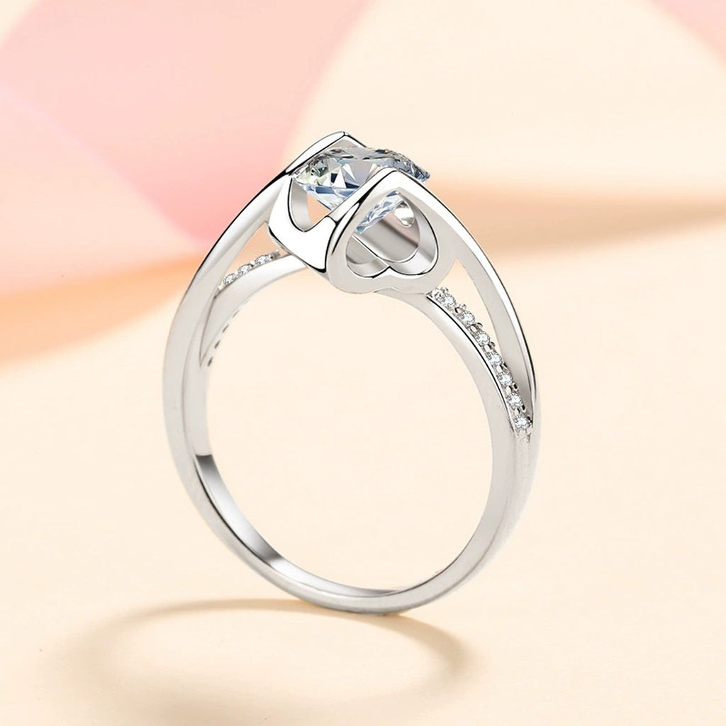 Round Moissanite Side Stone Ring with CZ worn on hand to show scale and ring profile