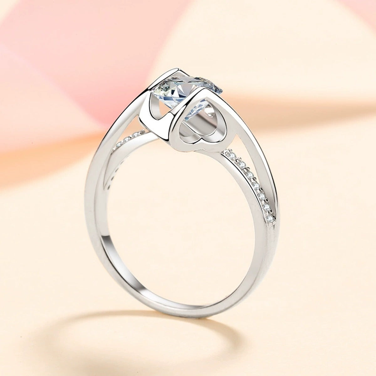 Round Moissanite Side Stone Ring with CZ worn on hand to show scale and ring profile