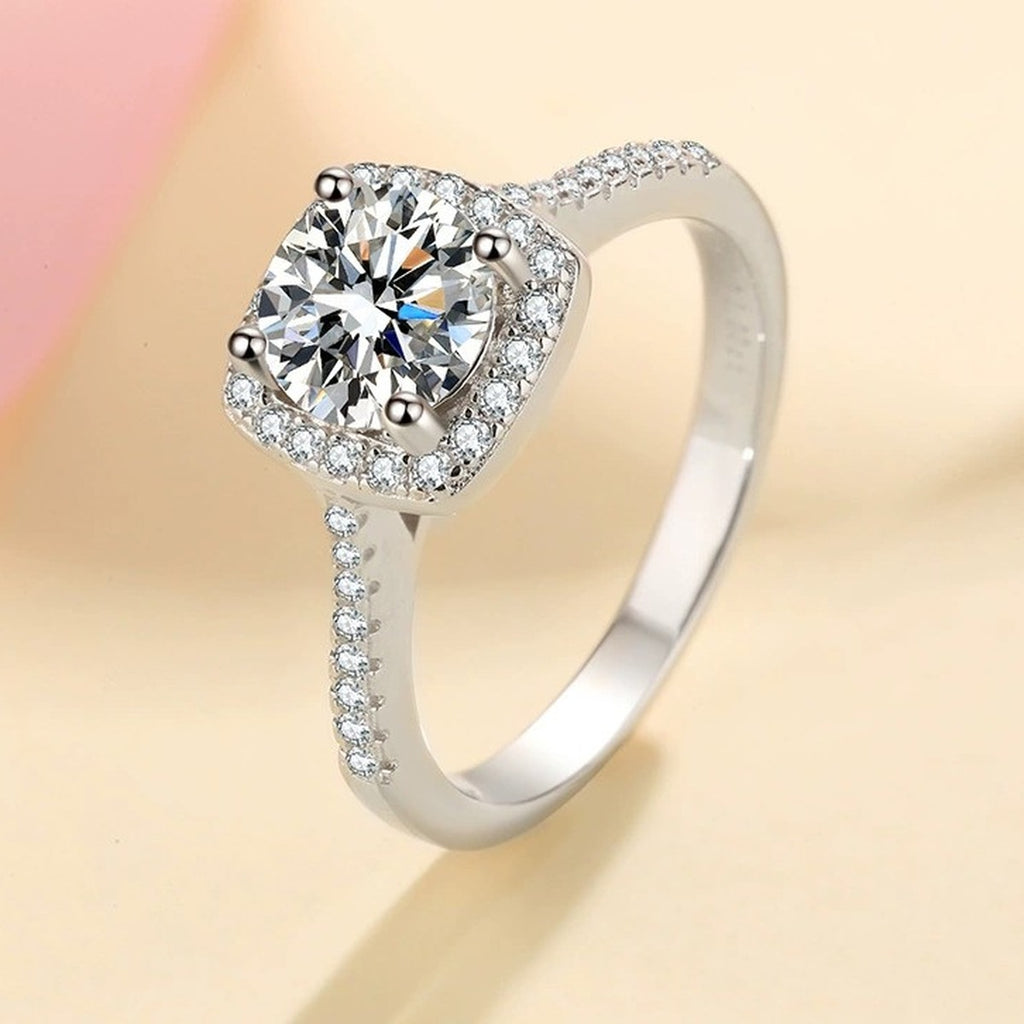 Cushion Halo Moissanite Ring with CZ worn on hand to show scale and ring profile