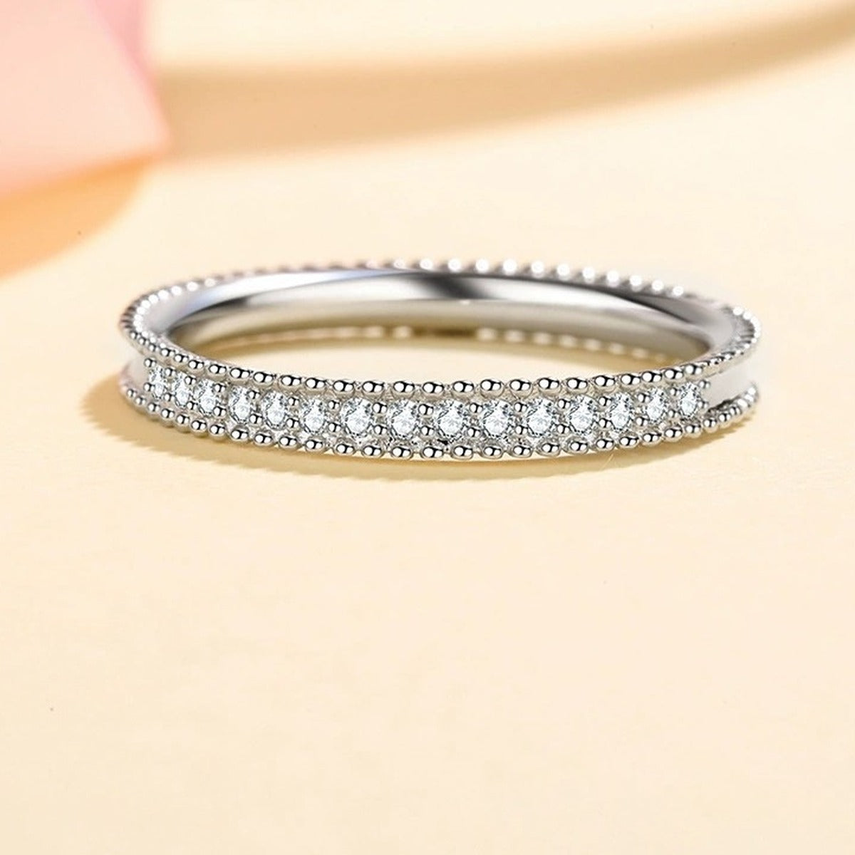 Round Moissanite Ring worn on hand to show scale and ring profile