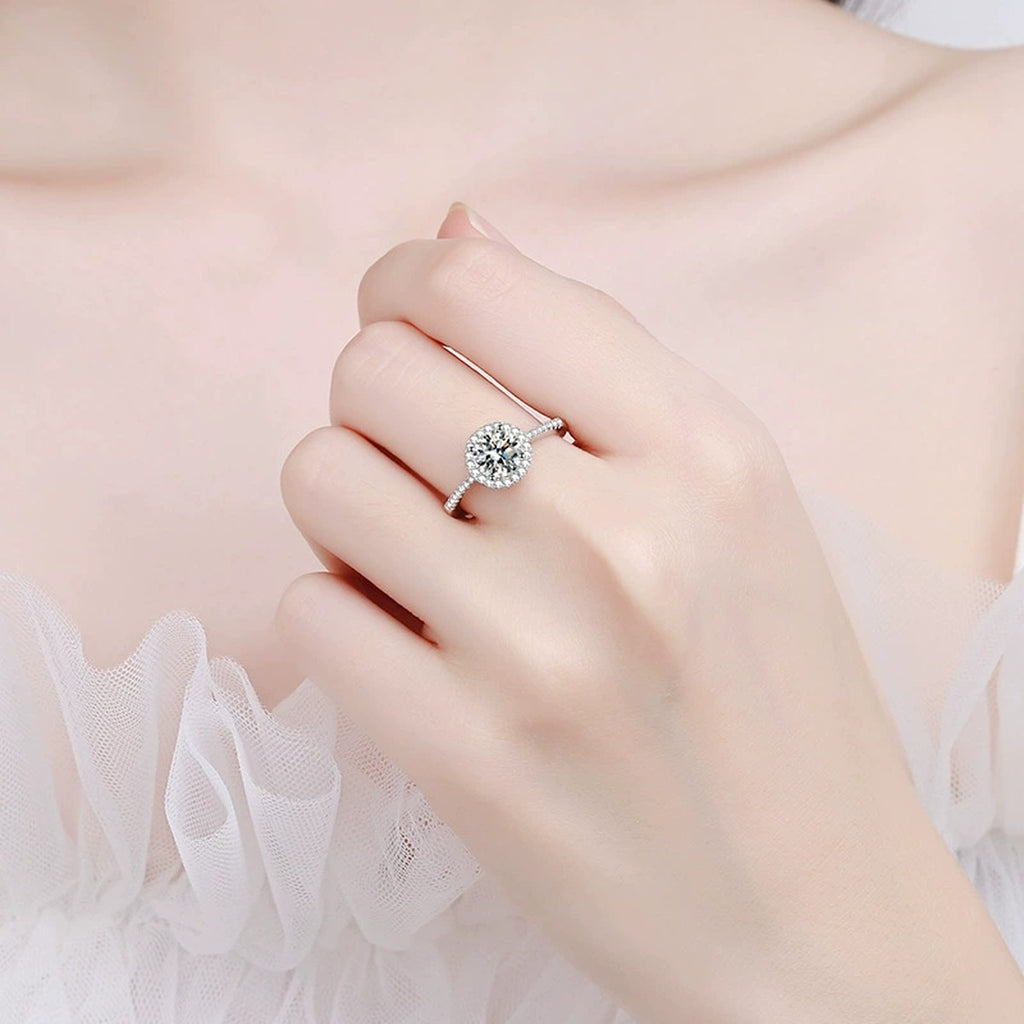 Round Moissanite Side Stone Ring with CZ worn on hand to show scale and ring profile