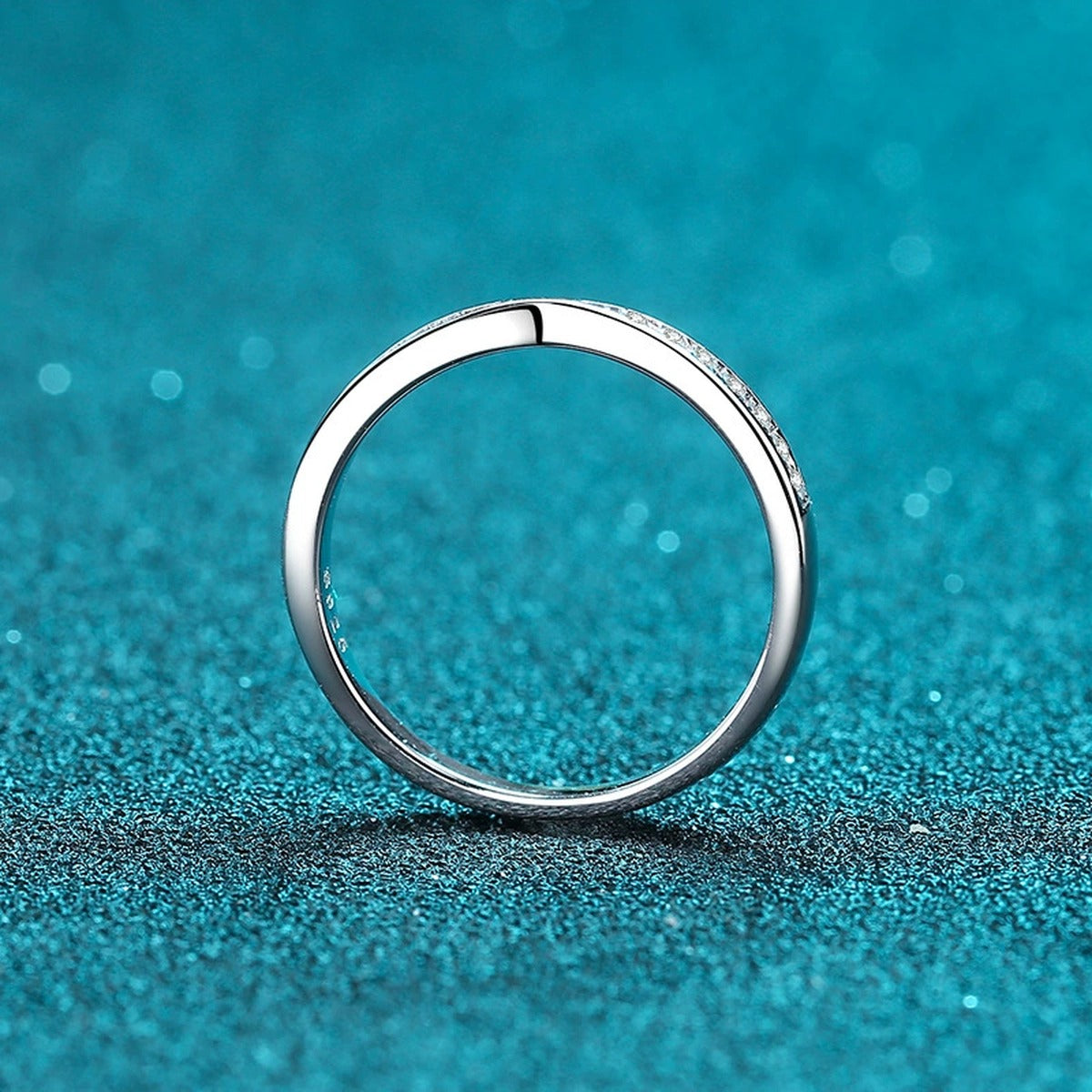 Round Moissanite Ring product view showing moissanite setting and rhodium finish