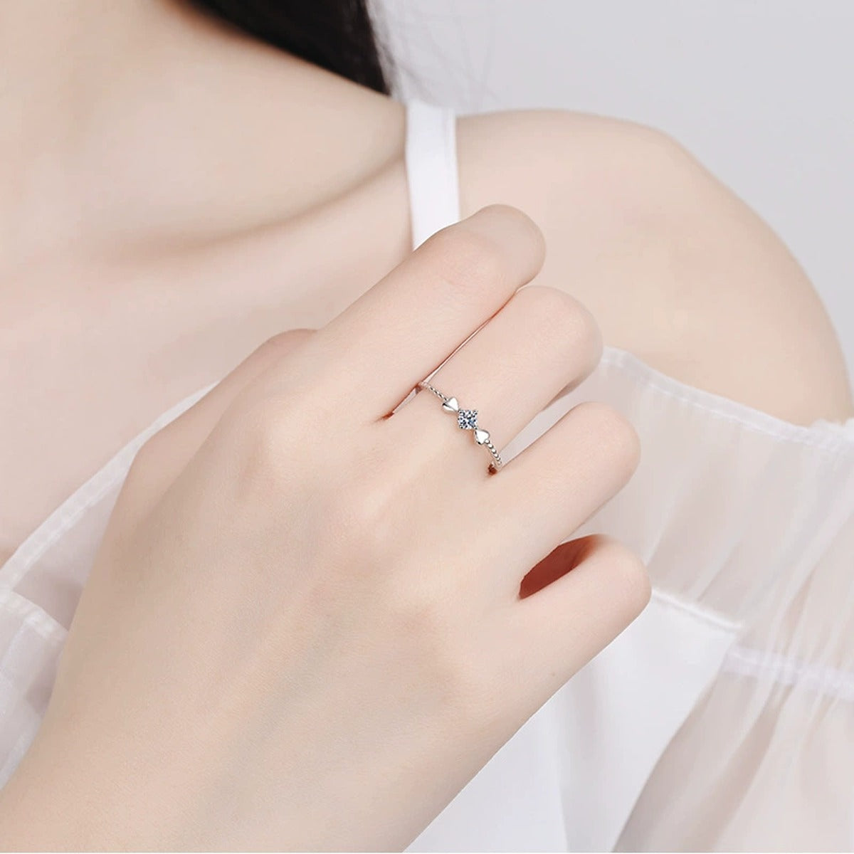 Floral Moissanite Ring worn on hand to show scale and ring profile