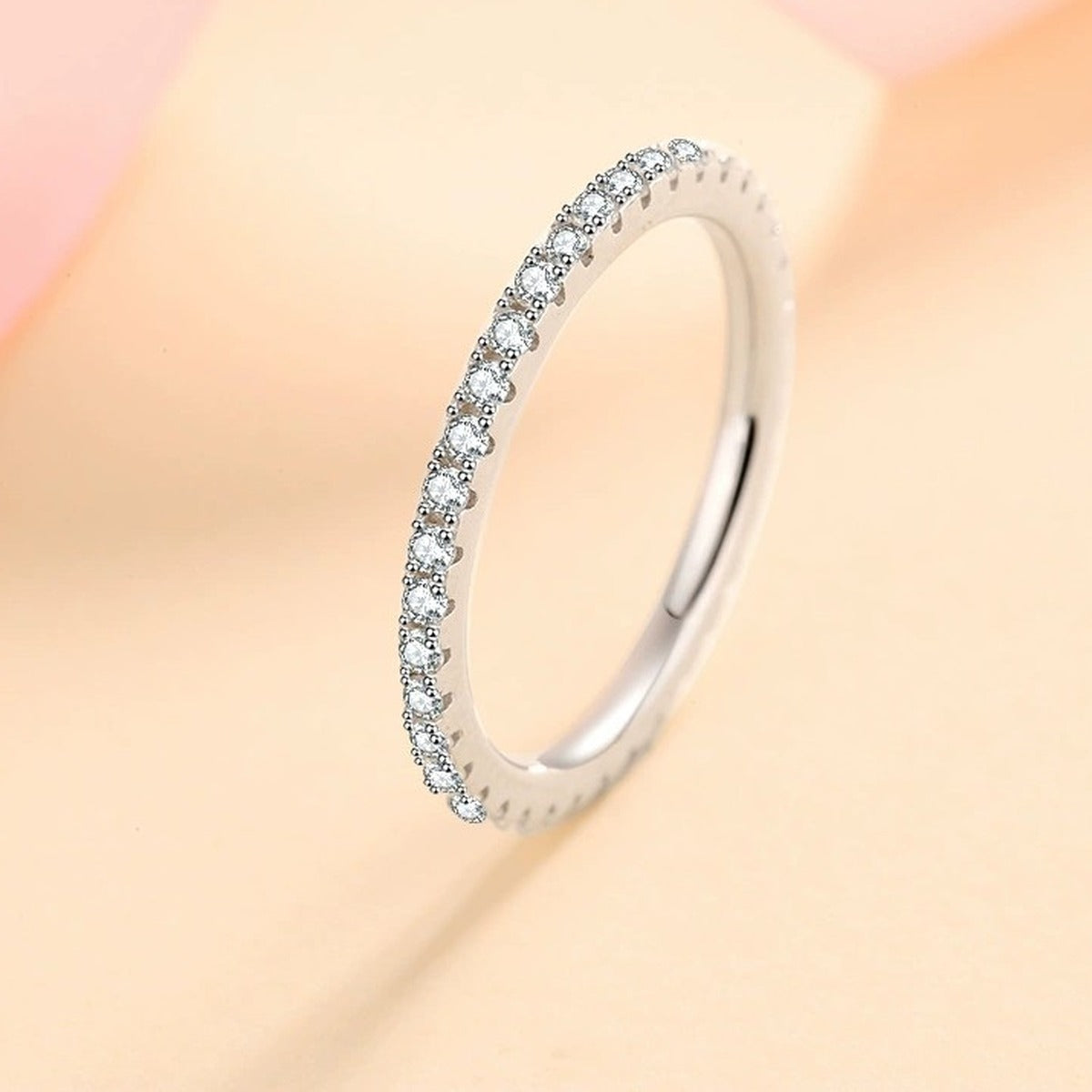 Slim Moissanite Eternity Band Ring worn on hand to show scale and ring profile