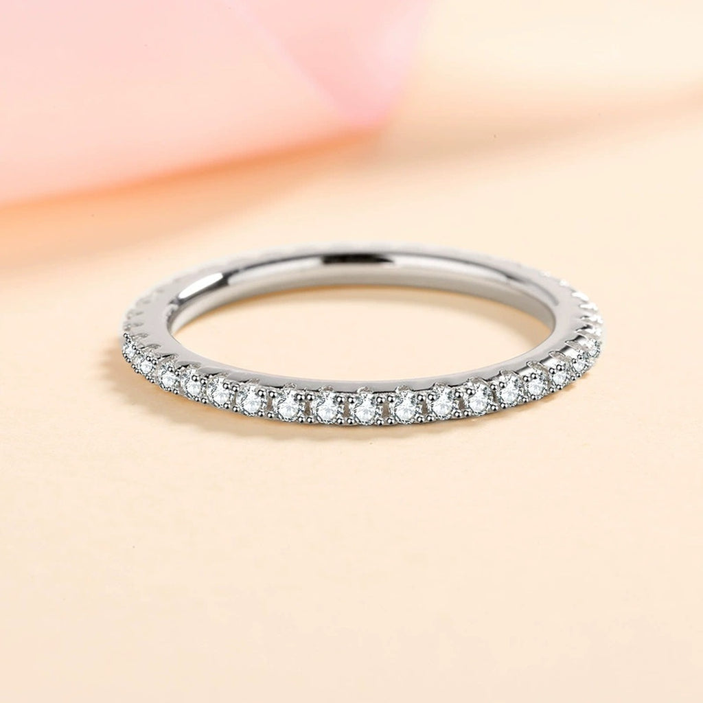 Slim Moissanite Eternity Band Ring worn on hand to show scale and ring profile