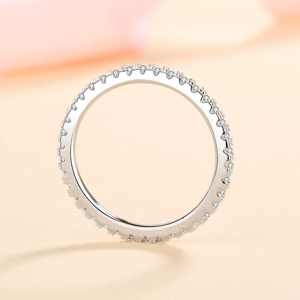 Slim Moissanite Eternity Band Ring worn on hand to show scale and ring profile