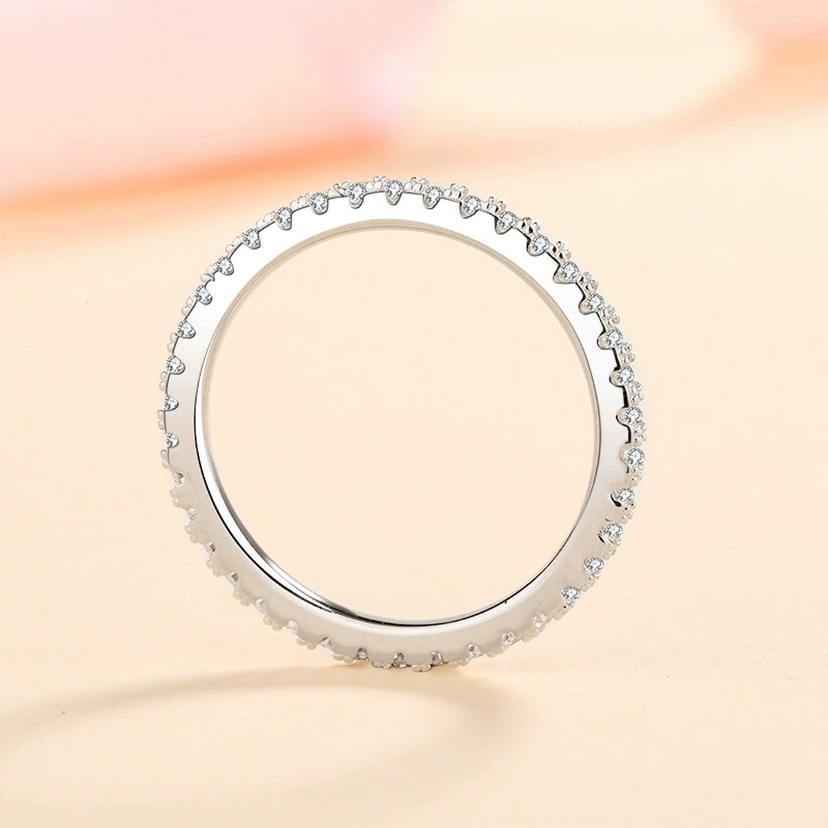 Slim Moissanite Eternity Band Ring worn on hand to show scale and ring profile