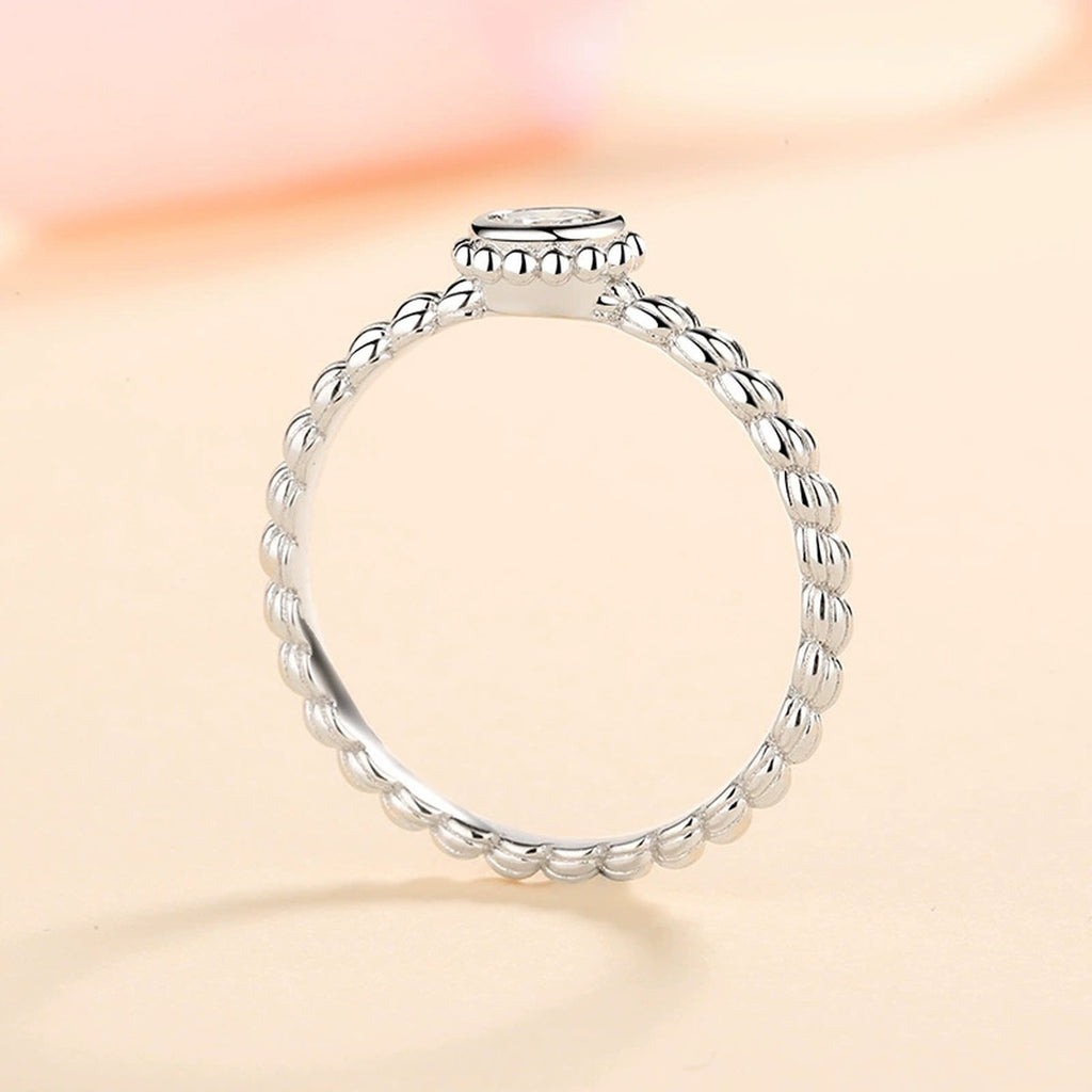 Bezel Moissanite Band Ring worn on hand to show scale and ring profile
