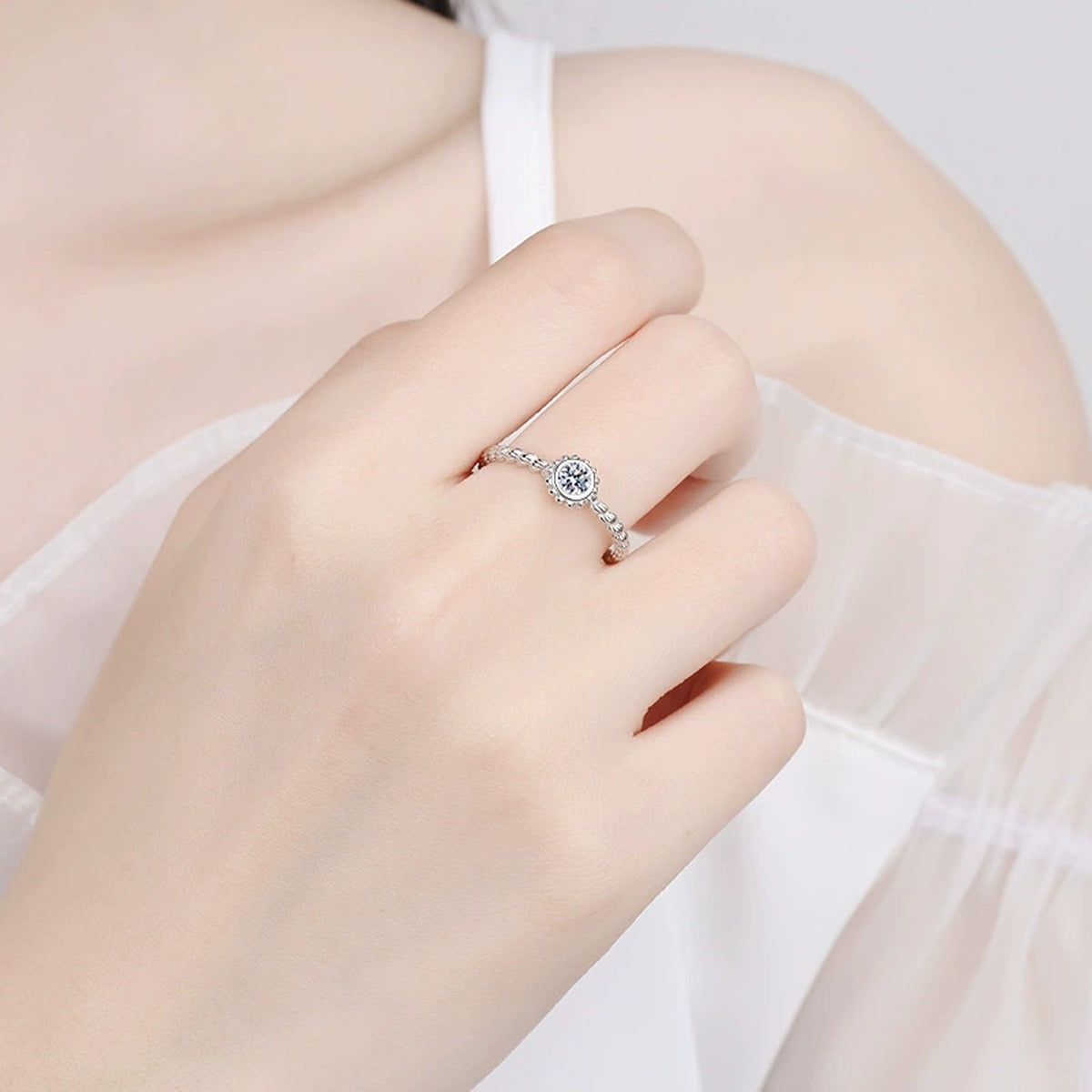 Bezel Moissanite Band Ring worn on hand to show scale and ring profile