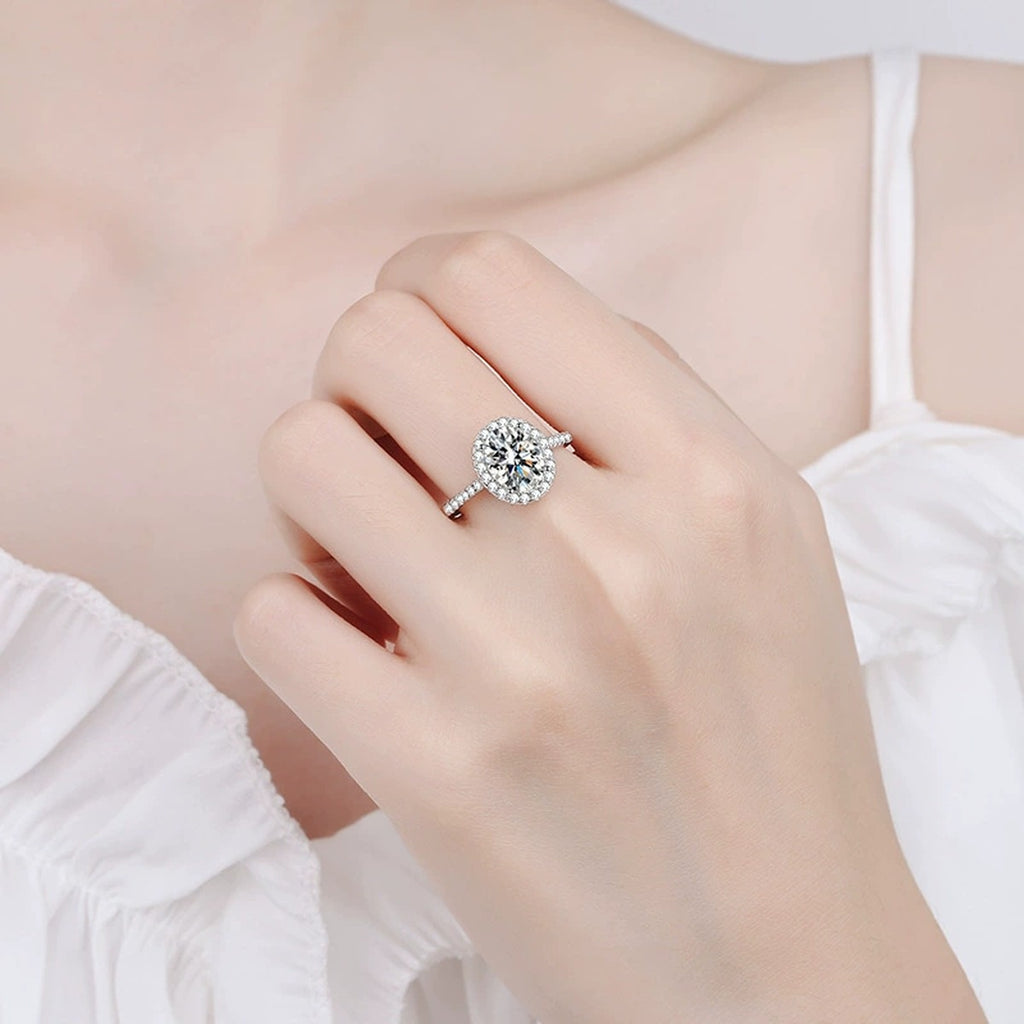 Oval Moissanite Ring with CZ worn on hand to show scale and ring profile