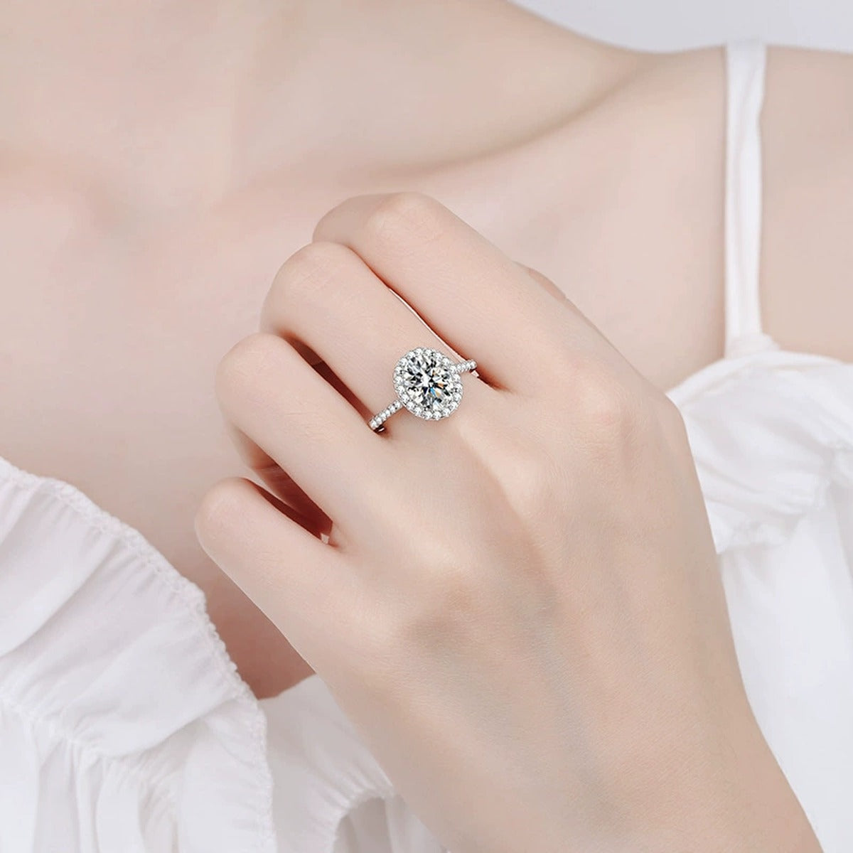 Oval Moissanite Ring with CZ worn on hand to show scale and ring profile